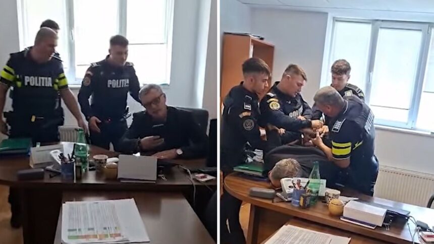 video un sef de institutie care a amenintat un jurnalist iesean ridicat din birou cu catuse de politisti se incuiase in birou dupa ce a fost suspendat din functie 69f9e7179367a